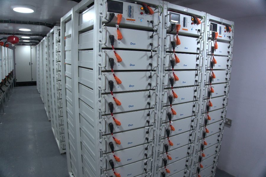 Deye high-voltage lithium battery racks in a temperature-controlled power room